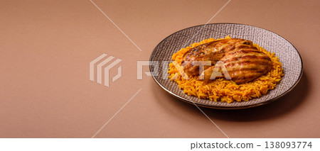 Kabsa or haneeth, an Arabic dish with rice and chicken, salt, and spices. Kabsa or haneeth Kabsa or haneeth, an Arabic dish with rice and chicken, salt, and spices. Kabsa or haneeth 138093774