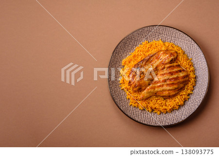 Kabsa or haneeth, an Arabic dish with rice and chicken, salt, and spices. Kabsa or haneeth Kabsa or haneeth, an Arabic dish with rice and chicken, salt, and spices. Kabsa or haneeth 138093775
