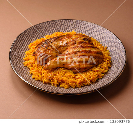 Kabsa or haneeth, an Arabic dish with rice and chicken, salt, and spices. Kabsa or haneeth 138093776