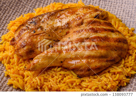Kabsa or haneeth, an Arabic dish with rice and chicken, salt, and spices. Kabsa or haneeth Kabsa or haneeth, an Arabic dish with rice and chicken, salt, and spices. Kabsa or haneeth 138093777