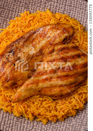 Kabsa or haneeth, an Arabic dish with rice and chicken, salt, and spices. Kabsa or haneeth Kabsa or haneeth, an Arabic dish with rice and chicken, salt, and spices. Kabsa or haneeth 138093778