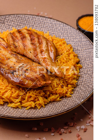 Kabsa or haneeth, an Arabic dish with rice and chicken, salt, and spices. Kabsa or haneeth 138093782