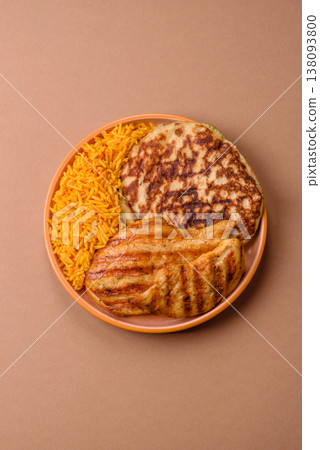 Dajaj Mashwi, an Arabic dish with rice and chicken, salt, and spices. Dajaj Mashwi as a background Dajaj Mashwi, an Arabic dish with rice and chicken, salt, and spices. Dajaj Mashwi as a background 138093800