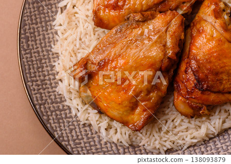 Kabsa or haneeth, an Arabic dish with rice and chicken, salt, and spices. Kabsa or haneeth 138093879