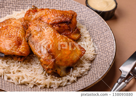Kabsa or haneeth, an Arabic dish with rice and chicken, salt, and spices. Kabsa or haneeth 138093880