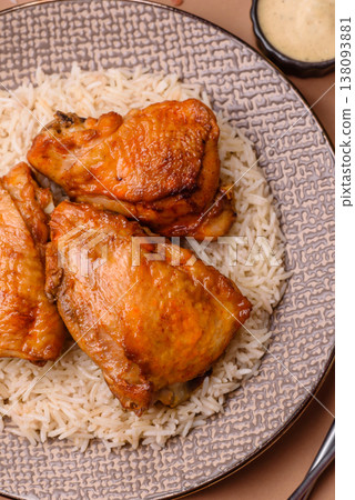Kabsa or haneeth, an Arabic dish with rice and chicken, salt, and spices. Kabsa or haneeth 138093881