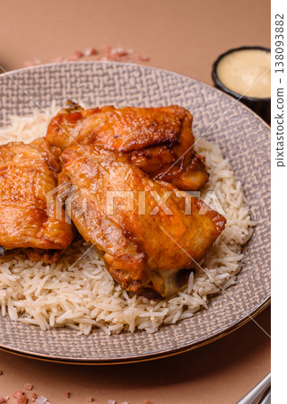 Kabsa or haneeth, an Arabic dish with rice and chicken, salt, and spices. Kabsa or haneeth Kabsa or haneeth, an Arabic dish with rice and chicken, salt, and spices. Kabsa or haneeth 138093882