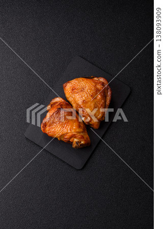 Grilled or barbecued chicken legs, spicy meat cooked with salt and spices. Grilled chicken legs Grilled or barbecued chicken legs, spicy meat cooked with salt and spices. Grilled chicken legs 138093909