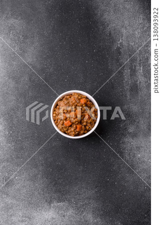 Lentil, carrot, and tomato stew with sausages, a European dish. Lentils with sausages 138093922
