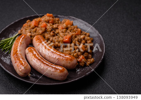 Lentil, carrot, and tomato stew with sausages, a European dish. Lentils with sausages Lentil, carrot, and tomato stew with sausages, a European dish. Lentils with sausages 138093949