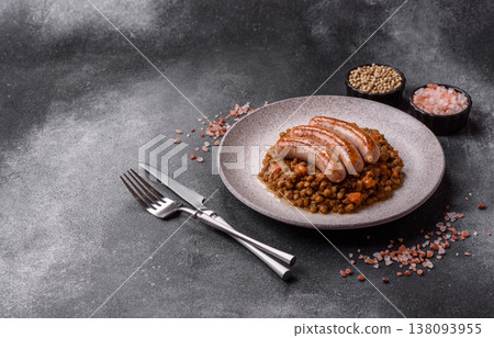 Lentil, carrot, and tomato stew with sausages, a European dish. Lentils with sausages Lentil, carrot, and tomato stew with sausages, a European dish. Lentils with sausages 138093955