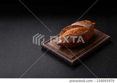 A loaf of homemade whole grain rye bread for the dinner table. A loaf of rye bread 138093979