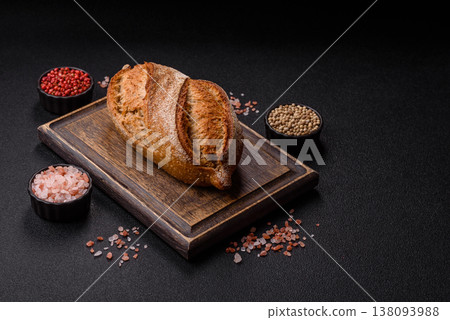 A loaf of homemade whole grain rye bread for the dinner table. A loaf of rye bread A loaf of homemade whole grain rye bread for the dinner table. A loaf of rye bread 138093988