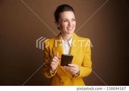 Focused Businesswoman Interacting with Smartphone Focused Businesswoman Interacting with Smartphone 138094167