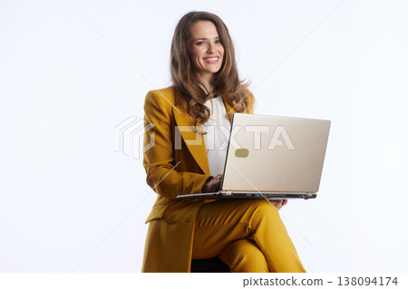Productive Woman with Gold Laptop Productive Woman with Gold Laptop 138094174