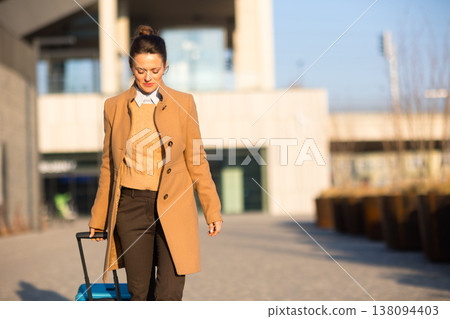 Focused Female Traveler Walking to Train Platform Focused Female Traveler Walking to Train Platform 138094403