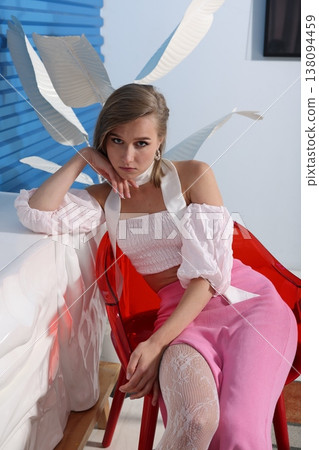 Fashionable woman poses with playful bunny ears styling 138094459
