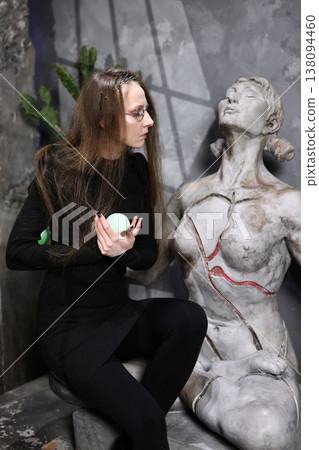 Female researcher inspecting ancient stone relic carefully Female researcher inspecting ancient stone relic carefully 138094460