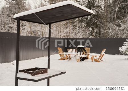 Serene woodland scene with flickering flames and cozy group of friends 138094581