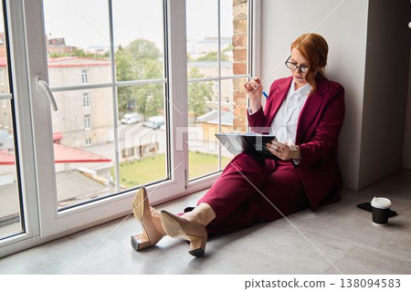 Creative writer takes mindful break observing cityscape thoughtfully Creative writer takes mindful break observing cityscape thoughtfully 138094583