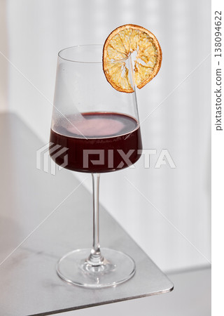 Luxurious Establishment Presenting Deephued Wines Complemented By Fresh Oranges And Gentle Ambient Lighting 138094622