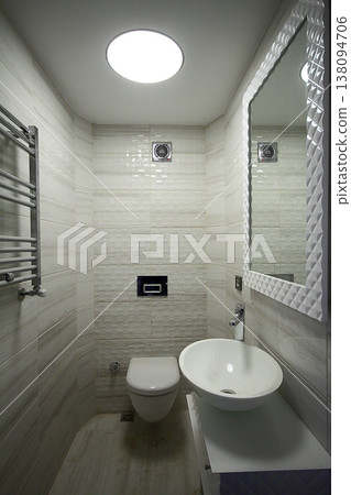 Modern minimalist bathroom with bathtub and clear tiles. Nobody inside 138094706