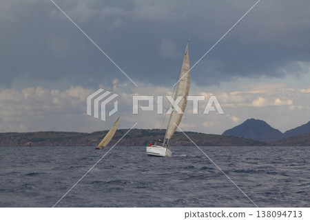 Close up on the bow of a sailboat breaking through a wave Close up on the bow of a sailboat breaking through a wave 138094713