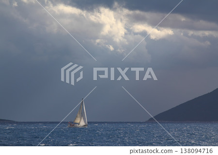 Close up on the bow of a sailboat breaking through a wave 138094716