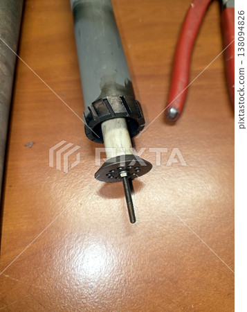 Industrial Igniter Part on a Workbench With Tools and Materials Present During Assembly 138094826