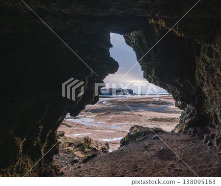 View from Loftsalahellir cave with Dyrholaey peninsula in the background, South Iceland. 138095163