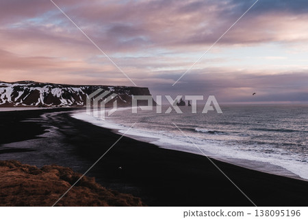 Reynisfjara black sand beach with Reynisdrangar sea stacks, South Iceland. Reynisfjara black sand beach with Reynisdrangar sea stacks, South Iceland. 138095196