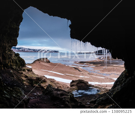 View from Loftsalahellir cave with Reynisdrangar sea stacks in the background, South Iceland View from Loftsalahellir cave with Reynisdrangar sea stacks in the background, South Iceland 138095225