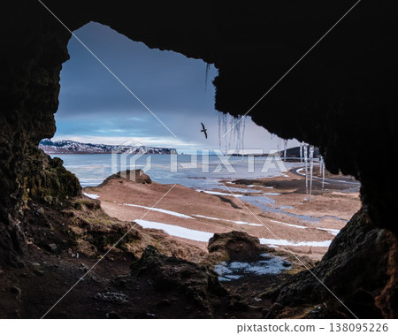 View from Loftsalahellir cave with Reynisdrangar sea stacks in the background, South Iceland View from Loftsalahellir cave with Reynisdrangar sea stacks in the background, South Iceland 138095226