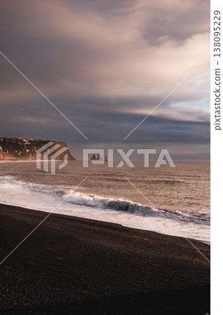 Reynisfjara black sand beach with Reynisdrangar sea stacks, South Iceland. Reynisfjara black sand beach with Reynisdrangar sea stacks, South Iceland. 138095229