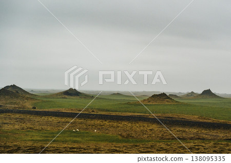Volcanic craters of Alftaversgigar surrounded by green fields, South Iceland. Volcanic craters of Alftaversgigar surrounded by green fields, South Iceland. 138095335