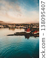 Aerial sunset view of Torshavn, showcasing colorful architecture and serene coastline. 138095407