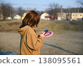 A girl looking at her smartphone in the park 138095561
