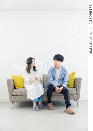 A relaxing couple in the living room A relaxing couple in the living room 138096371