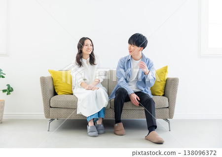 A relaxing couple in the living room A relaxing couple in the living room 138096372