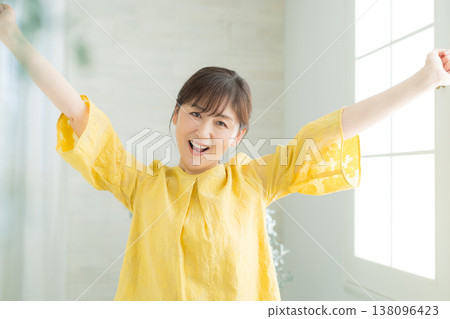 A woman in her 60s by the window 138096423