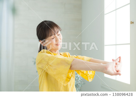 A woman in her 60s by the window A woman in her 60s by the window 138096428