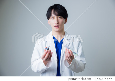 A young man wearing a white suit A young man wearing a white suit 138096566