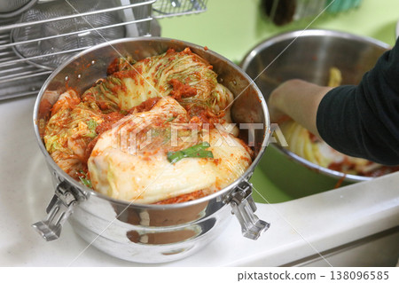 A woman making kimchi 138096585