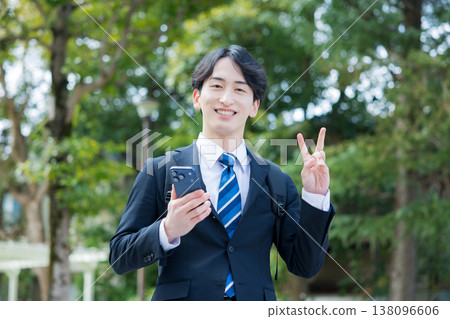 Young businessman with a smartphone Young businessman with a smartphone 138096606
