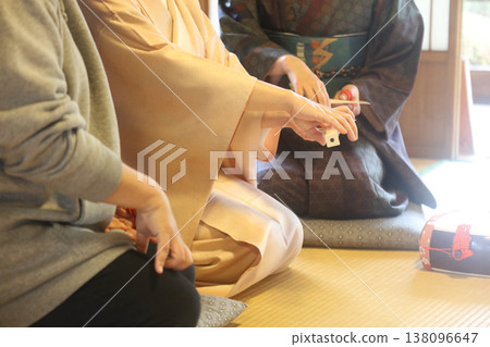 A woman playing a shamisen A woman playing a shamisen 138096647