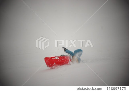 A boy playing in a park in Hokkaido in the middle of winter. A boy playing in a park in Hokkaido in the middle of winter. 138097175