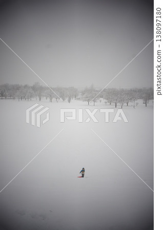 A boy playing in a park in Hokkaido in the middle of winter. A boy playing in a park in Hokkaido in the middle of winter. 138097180