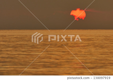 Magical sunset with orange sky at dusk on Maldives islands, the rays of the sun through the clouds, reflection on the water in beach, no people Magical sunset with orange sky at dusk on Maldives islands, the rays of the sun through the clouds, reflection on the water in beach, no people 138097919