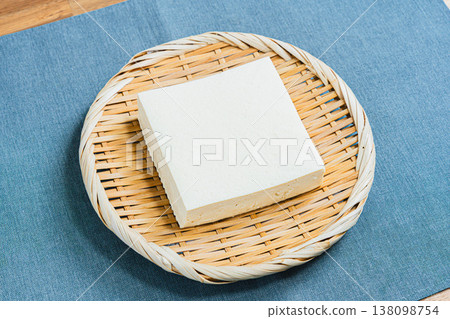 Firm tofu placed on a sieve; Japanese food ingredients on the table 138098754