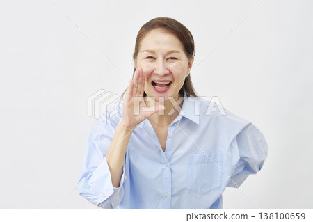 Woman cheering on white background Woman cheering on white background 138100659
